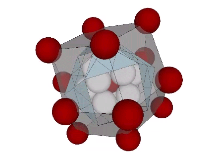 A transparent rhombic dodecahedron with red nuclei at each vertex, enclosing a two-frequency VE, and nucleus surrounded by one shell of radially close-packed spheres.