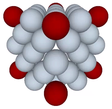 Cube constructed of two shells of radially close-packed spheres and the eight potential nuclei (red) from the third shell.