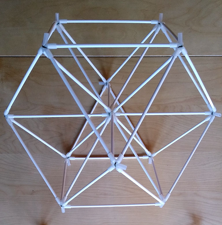 Photograph of vector equilibrium (VE) made from cake-pop sticks and connectors made from silicone rubber tubing.