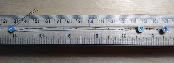 Photograph of a simple jig for measuring out consistent lengths of wire.