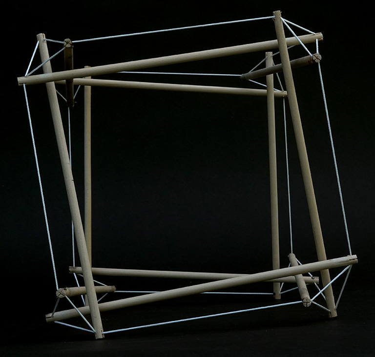 Model of the 12-strut tensegrity sphere in its transformation to the cube.
