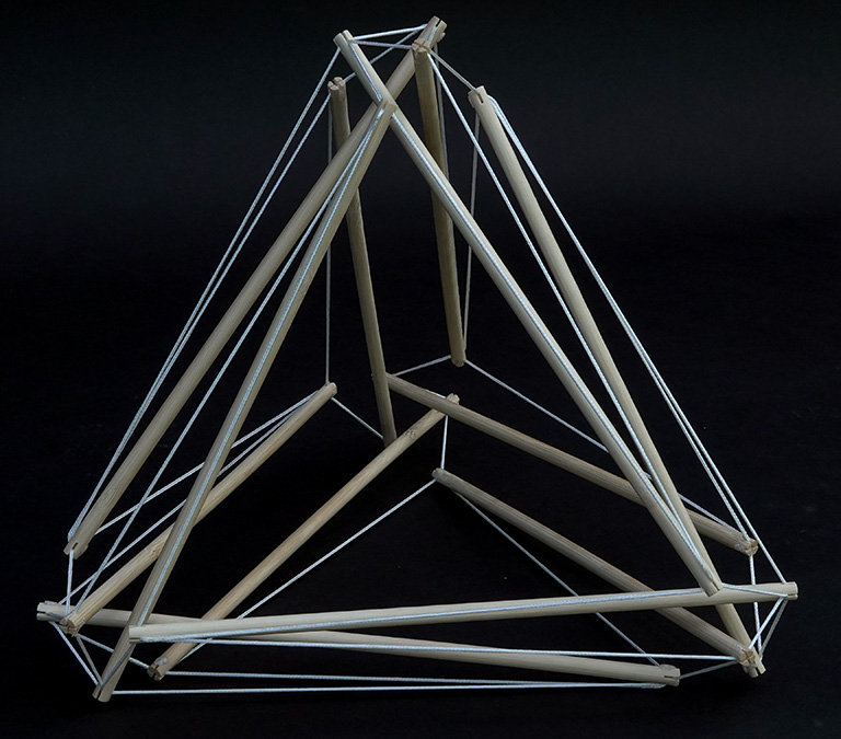 Model of the 12-strut tensegrity sphere in its transformation to the double-edge tetrahedron.