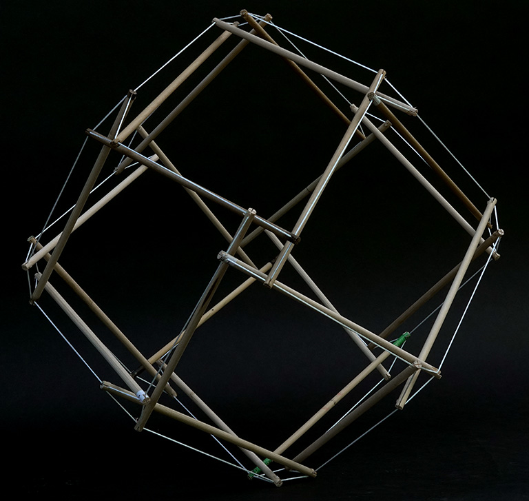 Model of the 24-strut tensegrity sphere in its transformation to the rhombic dodecahedron.