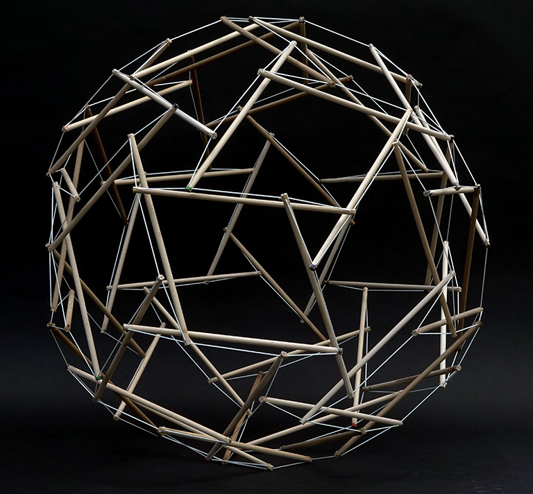 Model of the 60-strut tensegrity sphere in its transformation to the rhombic triacontahedron.